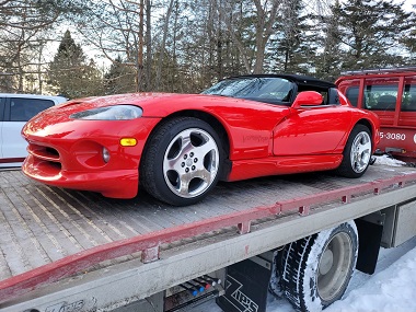 Viper car on flatbed tow truck